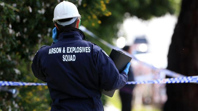 An arson squad detective at the scene. Picture: Sarah Matray