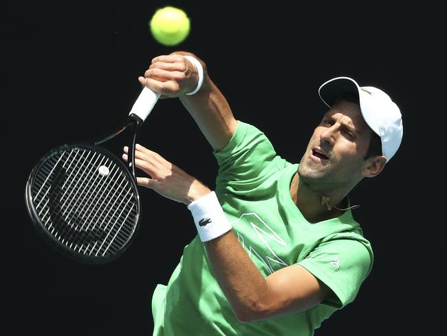 Serbia's Novak Djokovic hits a forehand return during a practice session ahead of the Australian Open tennis championship in Melbourne, Australia, Sunday, Jan. 19, 2020. (AP Photo/Dita Alangkara)