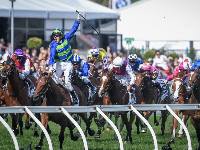 Nick Hall knew he had the Caulfield Cup in the bag a long way from home as his celebrations on Jameka revealed. Picture: Jake Nowakowski