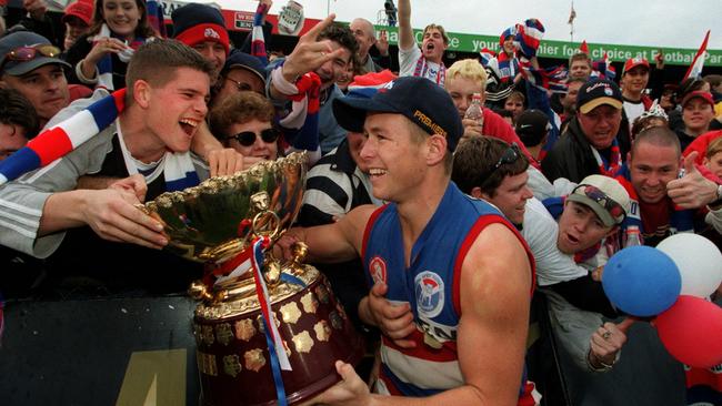 Dew celebrates playing in Central District’s first SANFL premiership in 2000.