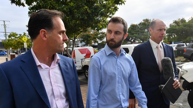 Dreamworld ride operator Timothy Williams (centre) is seen leaving the inquest into the Dreamworld disaster at the Southport Courthouse on the Gold Coast, Thursday, June 21, 2018. Cindy Low, Kate Goodchild, her brother Luke Dorsett and his partner Roozi Araghi all died when Dreamworld's Thunder River Rapids ride malfunctioned in October 2016. (AAP Image/Darren England)