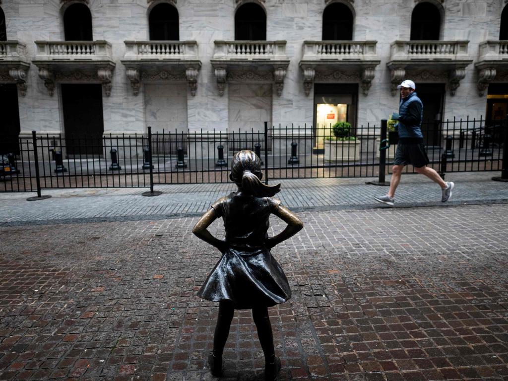 The Fearless Girl statue at the New York Stock Exchange, where markets have been rocked by the coronavirus pandemic. Picture: Johannes EISELE / AFP