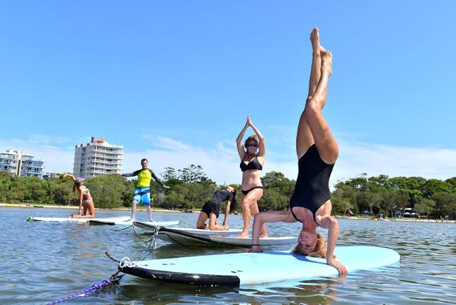 SUP Festival at Currimundi Lake was a family fun event. Sarah-Rose Sellars, Lorraine Paciullo, Kiran Mangat, Mark Thompson and Linn Thomassen combined yoga a SUP for some fun. Photo: John McCutcheon / Sunshine Coast Daily. Picture: john mccutcheon