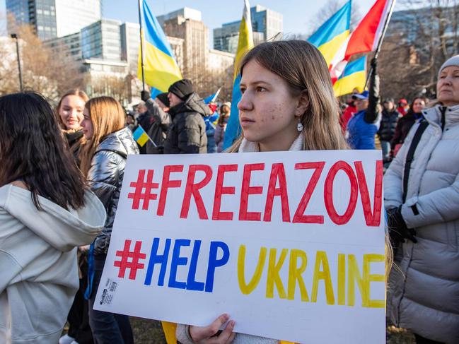 People hold signs and flags at a rally to mark the second anniversary of Russia's invasion of Ukraine and ten years since it annexed Crimea at Boston Common in Boston, Massachusetts. Picture: AFP