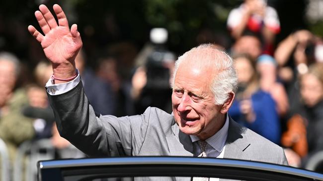 SOUTHPORT, ENGLAND - AUGUST 20: Britain's King Charles III waves as he leaves after visiting Southport Town Hall where he met with members of the local community following the July 29 attack at a children's dance party on August 20, 2024 in Southport, England. His Majesty met with those affected by the 29th July attack and riots alongside thanking front-line emergency staff for their ongoing work. (Photo by Paul Ellis - WPA Pool/Getty Images)