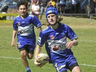 Koopah Walters heads for the line between the Grafton Ghosts and the Kyogle Turkeys in the under-12 grand final at Frank McGuren Field on Saturday. Picture: Mitchell Keenan