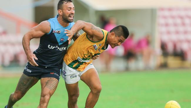 Buffalo Nyaburu Kelly and Saint Henry Labadista contest a loose ball. Picture: GLENN CAMPBELL