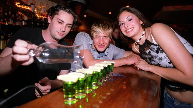 Ah, nothing brings back memories – or destroys them – like Midori cocktail shots. Natasha Lee with Nick Fahey and Karstiaan Buttery at Cargo Club, 2002. Picture: Tracey Nearmy