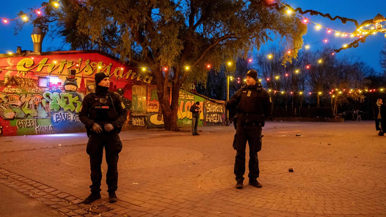 Police officers patrol Pusher Street in the Freetown Christiania, Copenhagen last year. The famous street where cannabis was available for sale closed on April 6, 2024. Picture: Mads Claus Rasmussen / Ritzau Scanpix / AFP