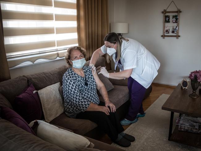 ISTANBUL, TURKEY - FEBRUARY 05: Mobile vaccination team member, nurse Meral Karatas, administers the Chinese Sinovac's Coronavac vaccine to 80 year old Meliha Terlikcioglu, during a house call on February 5, 2021 in Istanbul, Turkey. Since shipments of the Chinese Sinovac's Coronavac vaccine arrived in Turkey on December 30, 2020, medical teams have been working house to house to administer the COVID-19 vaccine to elderly and vulnerable citizens who are unable to attend a vaccination clinic or hospital or who are fearful to venture outside. Citizens over 75 years old who qualify for the vaccine are able to book an appointment online for one of the health ministryÃ¢â¬â¢s mobile vaccinations teams, who then come to their homes and administer the vaccine. Turkey's official drug and medical equipment body approved the Chinese Sinovac Coronavac vaccine for emergency use against the novel coronavirus on the 13th of January 2020. According to data from TurkeyÃ¢â¬â¢s Health Ministry the countryÃ¢â¬â¢s death toll from the coronavirus has reached 26,467 and the number of infections has topped 2.5 million since mid-March 2020. (Photo by Chris McGrath/Getty Images)