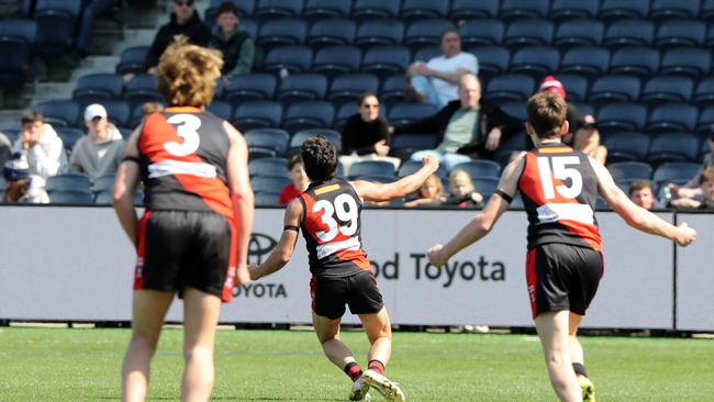 Ben Pennisi celebrates the goal that sealed Newtown's win. Picture: Alan Barber