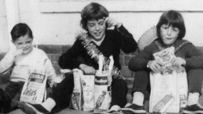 <p>(From left) Grant, Jane and Arnna Beaumont at home after they had visited the Royal Adelaide Show in Sep 1965. Supplied family album style pic of The Beaumont children, Jane, 9, Arnna, 7, and Grant, 4, who disappeared from Glenelg, SA, on 26 Jan 1966. (Copyright unknown)</p>