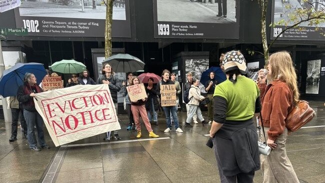 A group of protesters gather outside the RBA building.