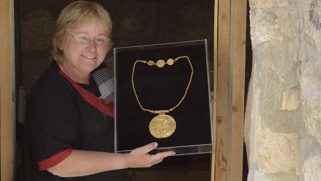 Hebrew University of Jerusalem archaeologist Dr. Eilat Mazar displays the 10-cm gold medallion discovered at the foot of the Temple Mount in Jerusalem. Picture: Ouria Tadmor