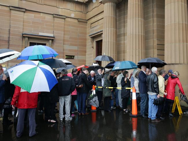 People waiting to enter the Supreme Court for the sentencing of Roger Rogerson and Glen McNamara. Picture: Jonathan Ng