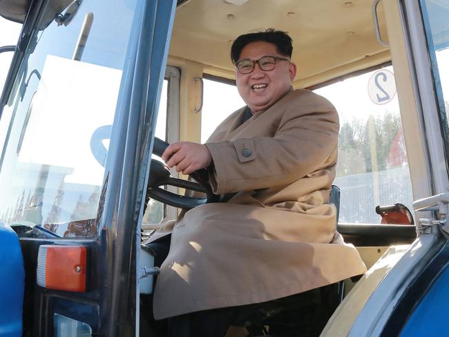 North Korean leader Kim Jong Un sits in a tractor at the Kumsong Tractor Factory, in Nampo, North Korea. Picture: AP.