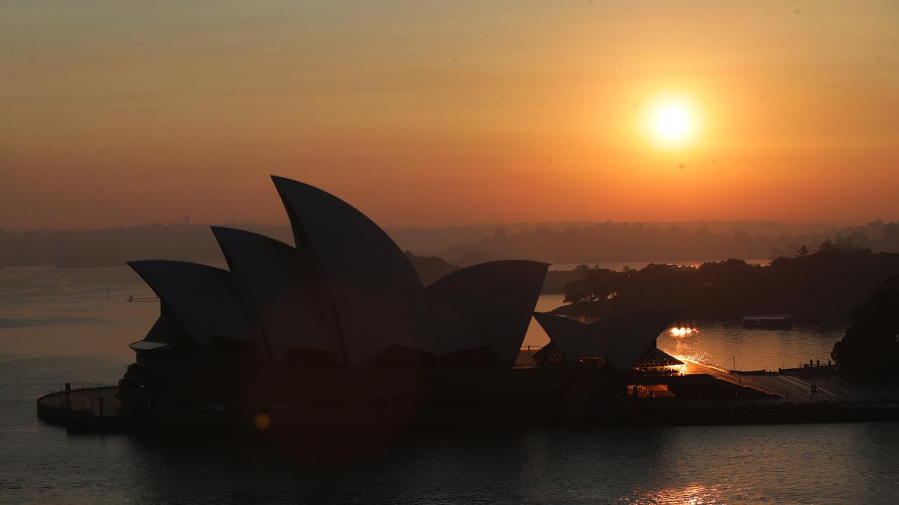 Smoke haze hangs over Sydney Harbour as the city wakes to warnings of catastrophic and unprecedented conditions. Picture: Bill Hearne