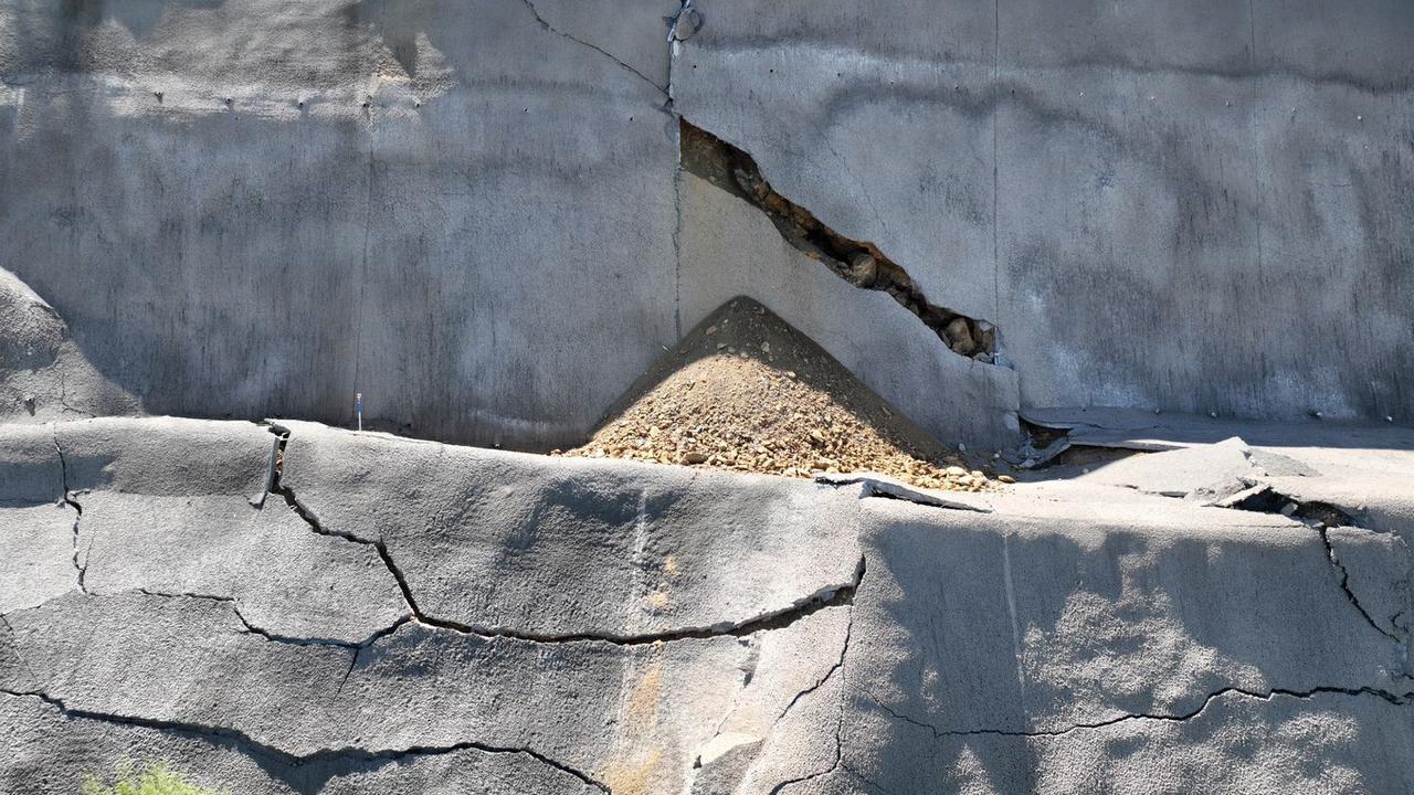 New aerial images showcase the damage sustained to the cutting of the Toowoomba Bypass, which has been closed by the Department of Transport and Main Roads for repairs.