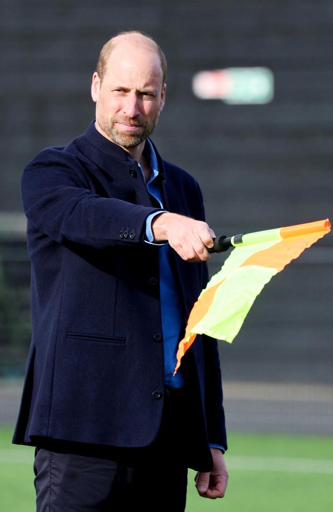 Prince William, Prince of Wales waves the linesman's flag during a mini football game as part of his visit to the FA Referee Training Course, at the Aspray Arena, in Willenhall, England, on on March 11, 2025. Picture: AFP