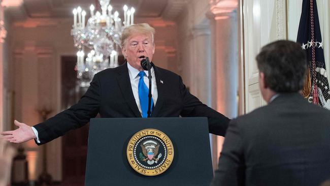 Donald Trump gets into a heated exchange with CNN chief White House correspondent Jim Acosta (R) during a post-election press conference in the East Room of the White House in 2018. Picture: AFP.