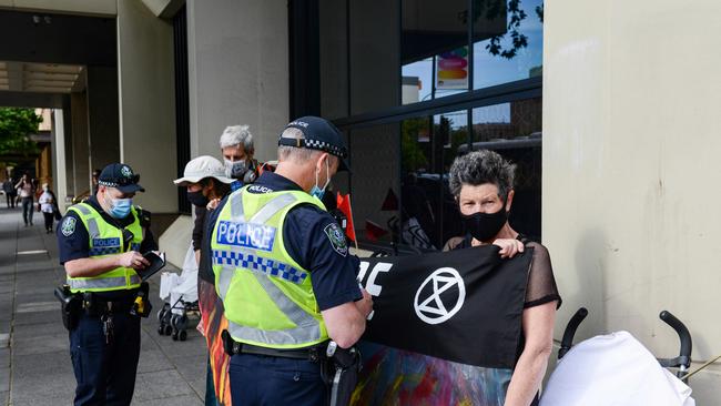 Police speak to Extinction Rebellion protesters in Victoria Square on Wednesday. Picture: NCA NewsWire/Brenton Edwards