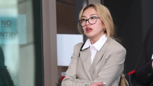 Melbourne nurse Kristine Pataclang leaves court after pleading guilty to intimidating a police officer who worked on the Luke Batty murder case. Picture: David Crosling.