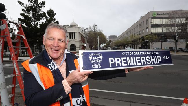 Peter Murrihy and the City of Greater Geelong has temporily changed the sign of Moorabool St to Premiership Way. Picture: Alan Barber