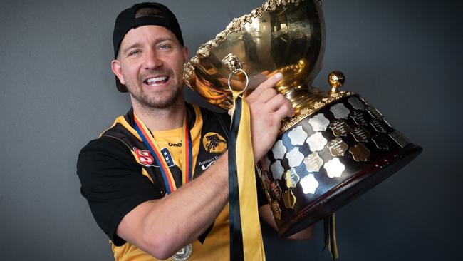 Matthew Snook with the Thomas Seymour Hill premiership trophy after announcing his retirement on Monday. Picture: Naomi Jellicoe