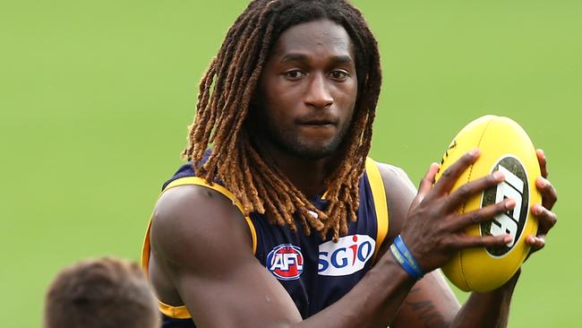 Nic Naitanui works on works on a handball drill.