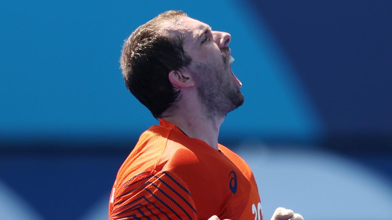 Andrew Charter roars in triumph after beating the Netherlands in penalties. Photo: Getty Images