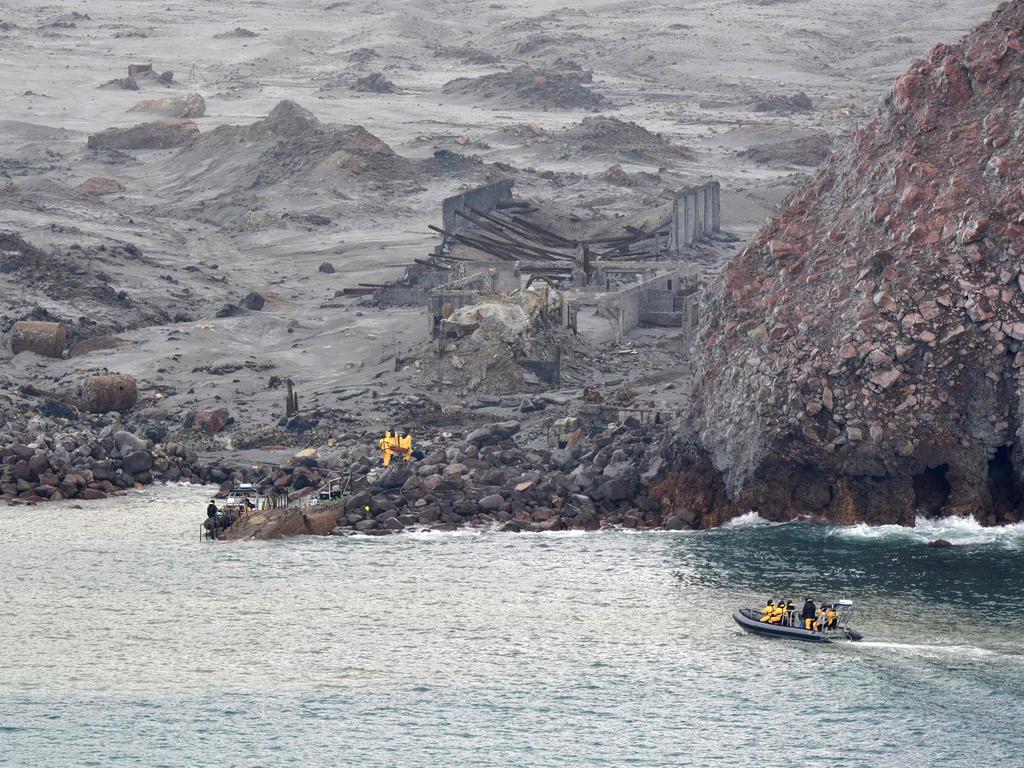 Navy divers were back searching for a seventh body off White island after SAS soldiers (above) recovered six on Friday in a daring mission. Picture: NZDF.