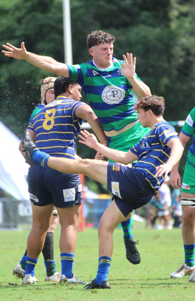 Pat Gavin puts pressure on scrumhalf Archie Xavier. Colts 1 club rugby action between Easts and GPS. Saturday April 6, 2024.