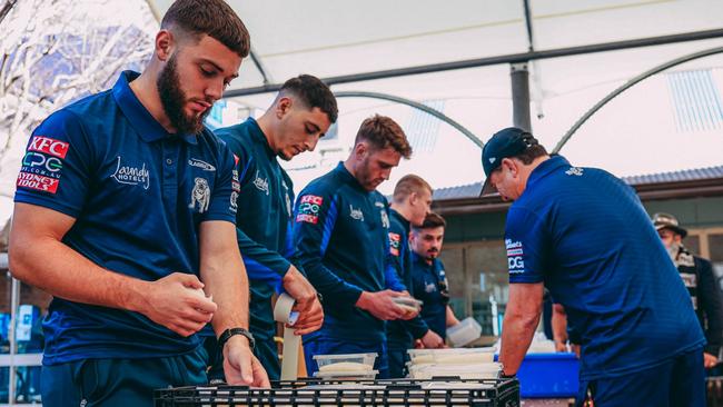 Canterbury Bulldogs feeding the homeless for their Mad Monday celebration at Loaves and Fishes in Sydney. Photo: Supplied