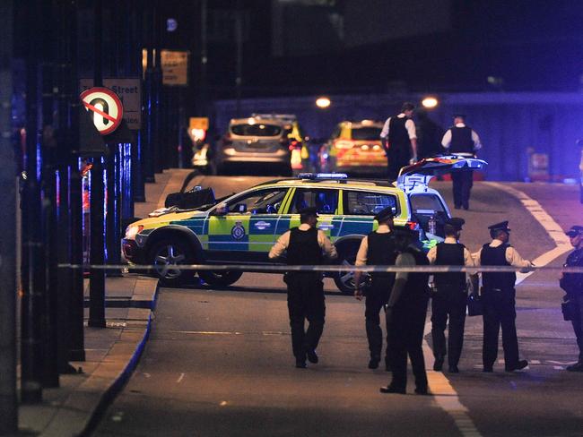 Police officers walk at the scene of an apparent terror attack on London Bridge. Picture: AFP