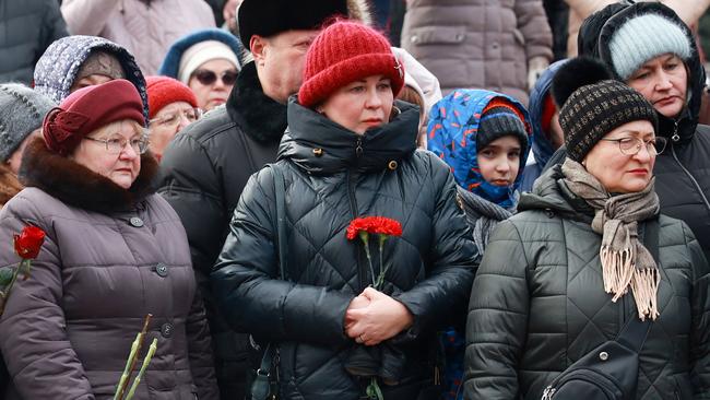 Mourners gather to lay flowers in memory of more than 60 Russian soldiers that Russia says were killed in a Ukrainian strike on Russian-controlled territory, in Samara. Picture: AFP.