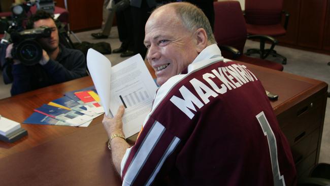 Ex-treasurer Terry Mackenroth talks up the Queensland budget in 2004 while wearing a Maroons jersey.