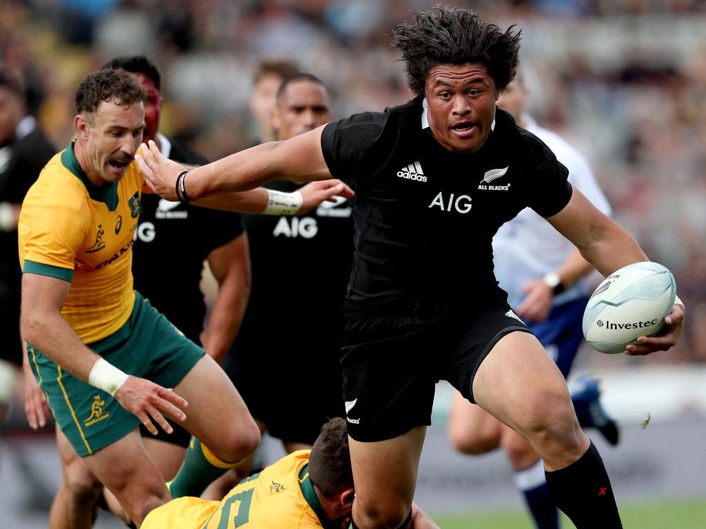 All Blacks star Caleb Clarke takes down the Wallabies. Picture: Michael Bradley/AFP