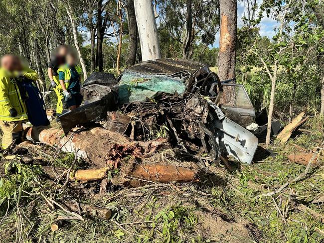 Emergency services at the scene of an accident at Greenlake Rd, Sandringham near Rockhampton where a young man's car rolled and collided with a tree on February 27, 2025, leaving him trapped and suffering life-threatening injuries.