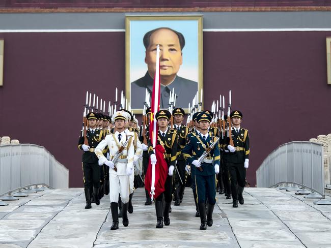 BEIJING, CHINA - AUGUST 01: Soldiers of Chinese National Flag Guard of Honor walk to Tiananmen Square for the flag-raising ceremony on the China's Army Day on August 1, 2018 in Beijing, China. People gather at Tiananmen Square to watch the flag-raising ceremony on the China's Army Day in Beijing. (Photo by VCG)