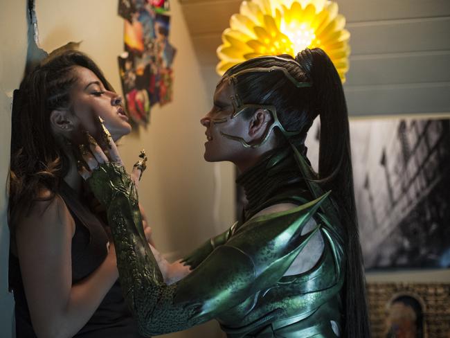 Teenagers will flock to see Becky G portraying Trini, the Yellow Ranger, left, and Elizabeth Banks’ character Rita Repulsa in Power Rangers. Picture: Kimberly French / Lionsgate