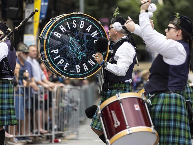 Brisbane Pipe Band make their way through the streets during the ANZAC Day parade in Brisbane city.Picture: Matthew Poon