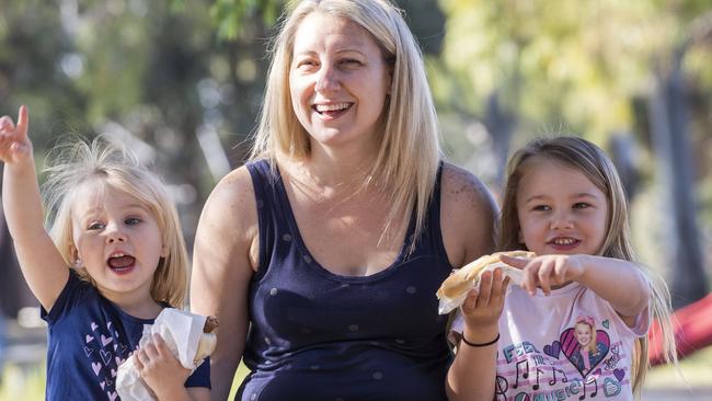 Karina Biner from Picnic Point with daughters Zoe and Olivia at Panania Public School. Picture: Matthew Vasilescu