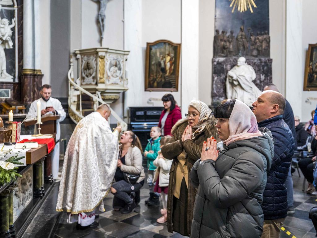 Ukrainian refugees attend an Orthodox Christmas service in Klooster Wittem in the Netherlands. Picture: AFP