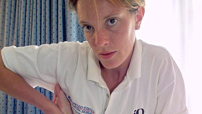 Emma O'Reilly tends to Lance Armstrong in July 1999. O'Reilly, an Irish woman, claimed he asked her to dispose of used syringes and lend him makeup to conceal needle marks on his arms. Picture: AP 