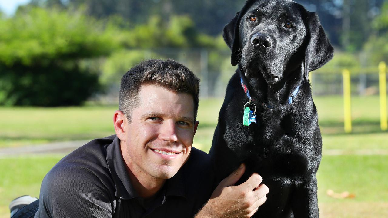 Guide Dog Mobility instructor Jason McKee with Victor the purebred Labrador Retriever. Photographer: Liam Kidston.