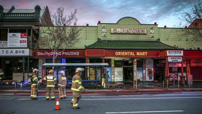 Firefighters on Grote St, at Chinatown near the Central Markets, where a huge blaze broke out overnight. Picture: AAP / Mike Burton