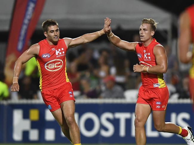 Darcy Macpherson (r) of the Suns celebrates after kicking a goal during the 2019 JLT Community Series AFL match between the Gold Coast Suns and the Western Bulldogs at Great Barrier Reef Arena on March 03, 2019 in Mackay, Australia. Picture: Hitchcock/Getty Images.