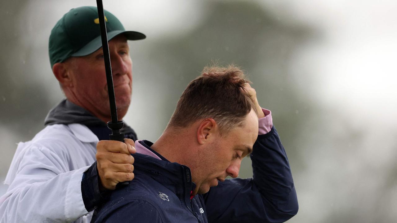 Justin Thomas reacts to his bogey on the 18th green, that handed Tiger Woods a reprieve. Picture: Getty