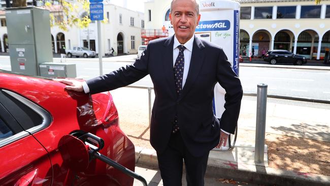 Opposition Leader Bill Shorten charging an electric car at the launch of Labor's Climate Change Action Plan in Canberra. Picture: Kym Smith\