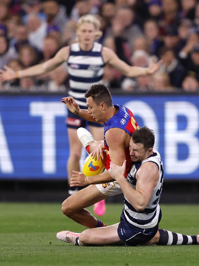 And drove him towards the ground. (Photo by Darrian Traynor/AFL Photos/via Getty Images)